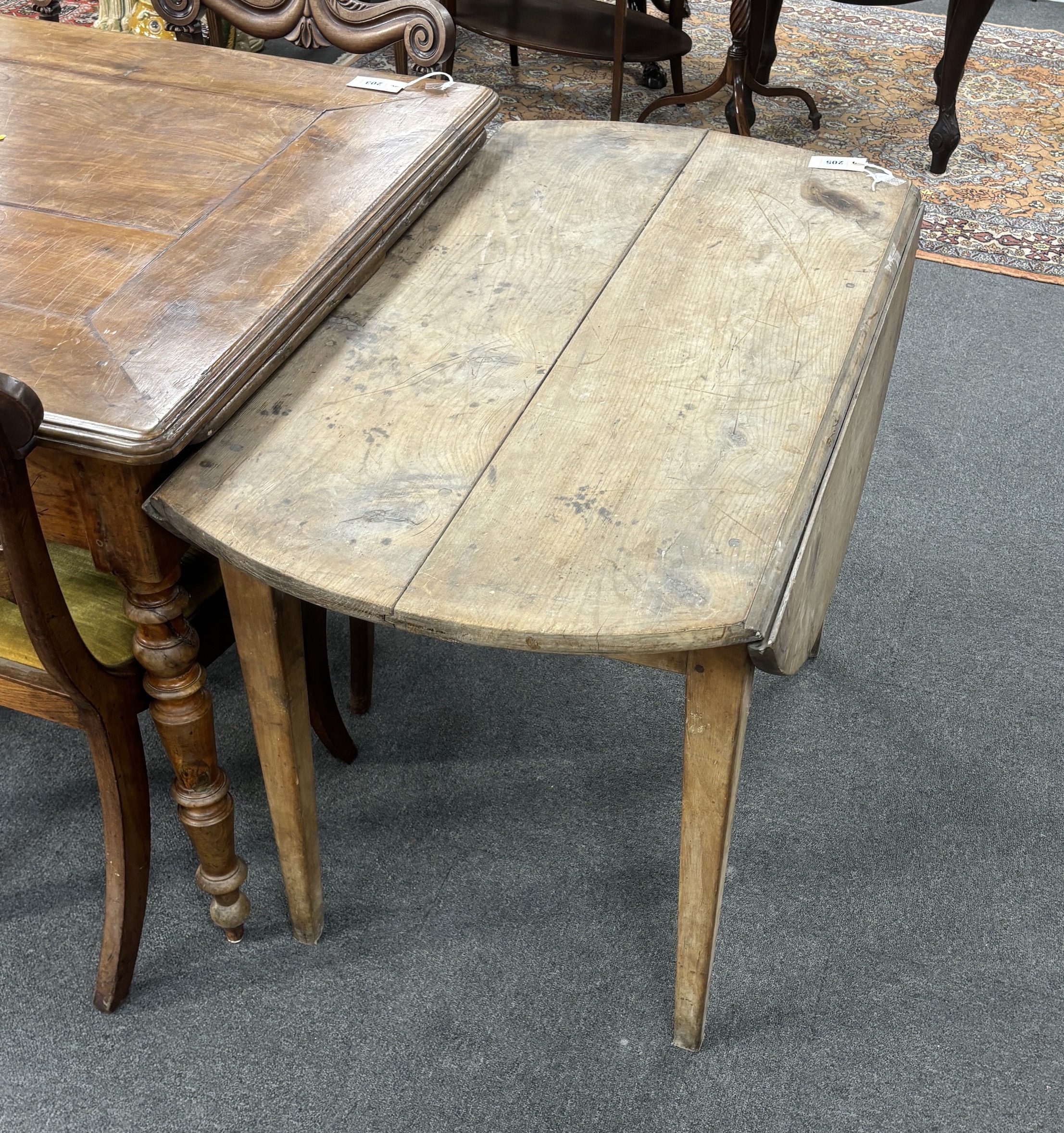 A 19th century French cherry drop leaf kitchen table, width 104cm, depth 58cm, height 72cm